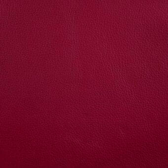 Red leather texture with fine grain, matte finish, and consistent osso coloration displaying subtle creases and natural lines.